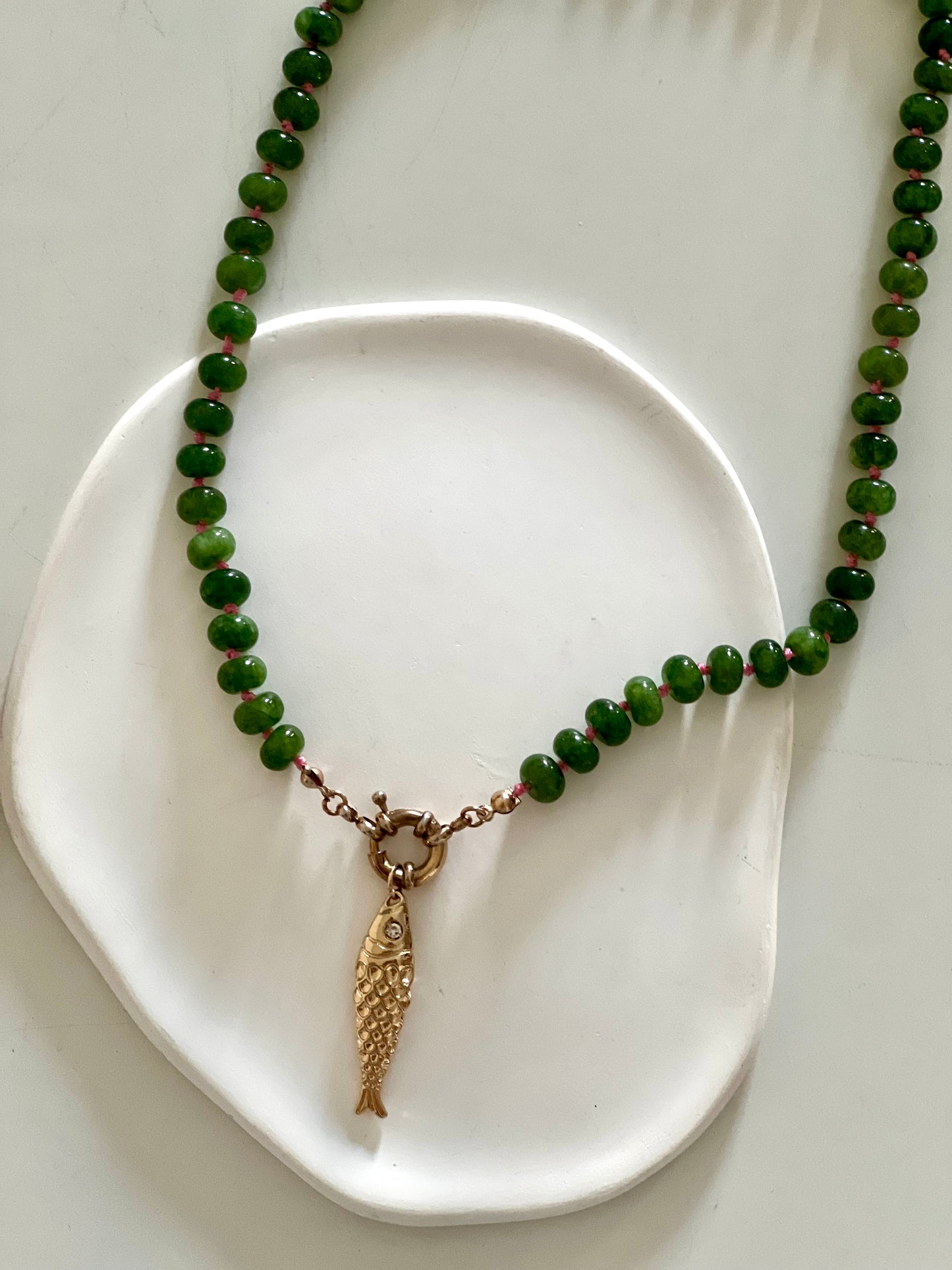 Green stones & golden Fish